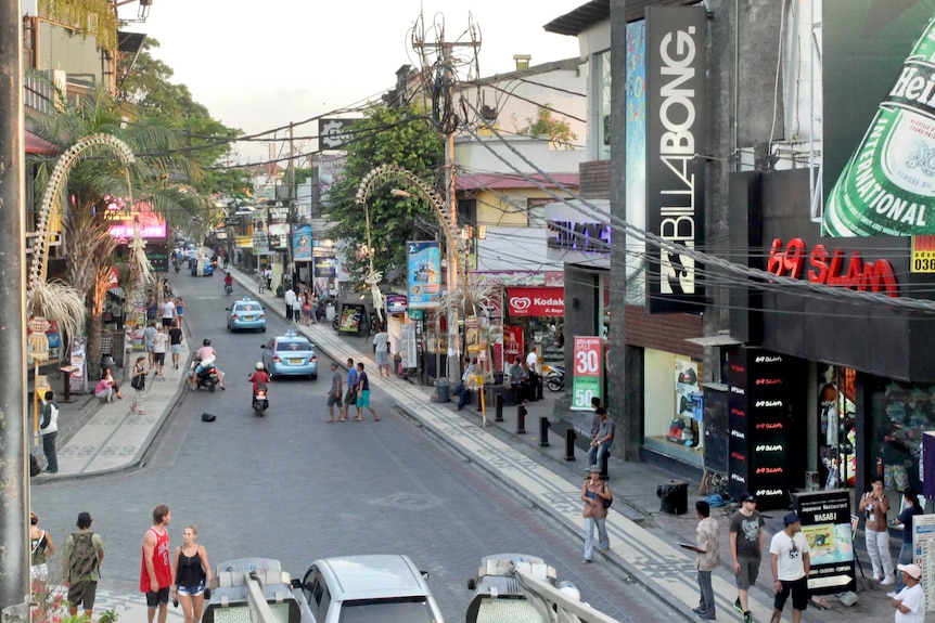 Traffic passes along Legian Street in Kuta.