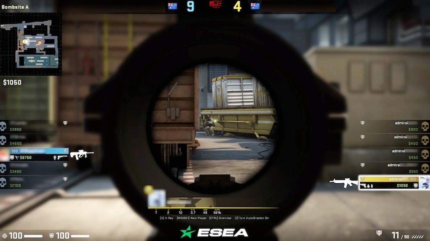 Screen capture of gameplay from Counter-Strike video game, with various graphics surrounding central view through a gun's scope