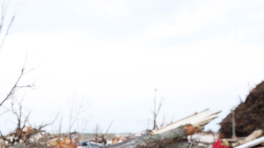 A stuffed toy lies among debris after a tornado in Missouri, US