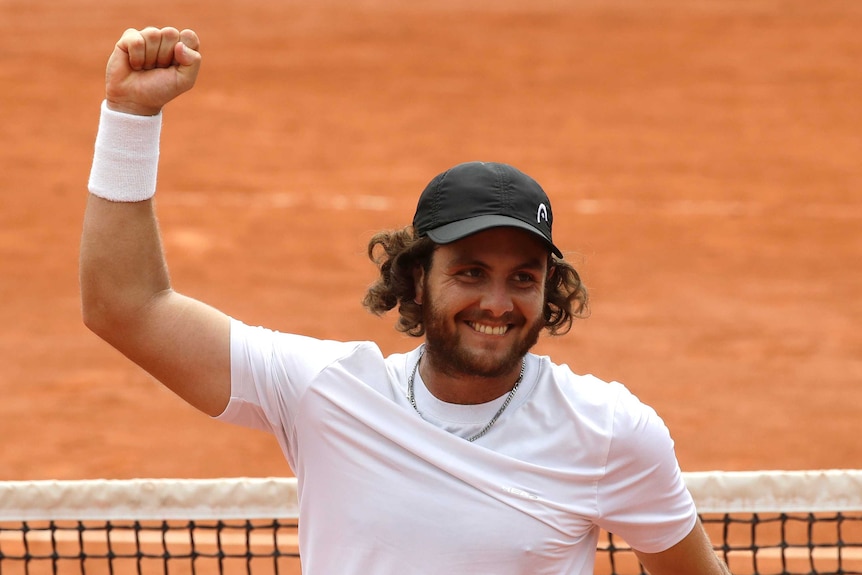 Argentina's Marco Trungelliti raises his fist after beating Bernard Tomic at the French Open.