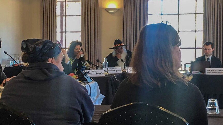 Members of the public watch on during a Senate Committee hearing in Kalgoorlie-Boulder, Western Australia