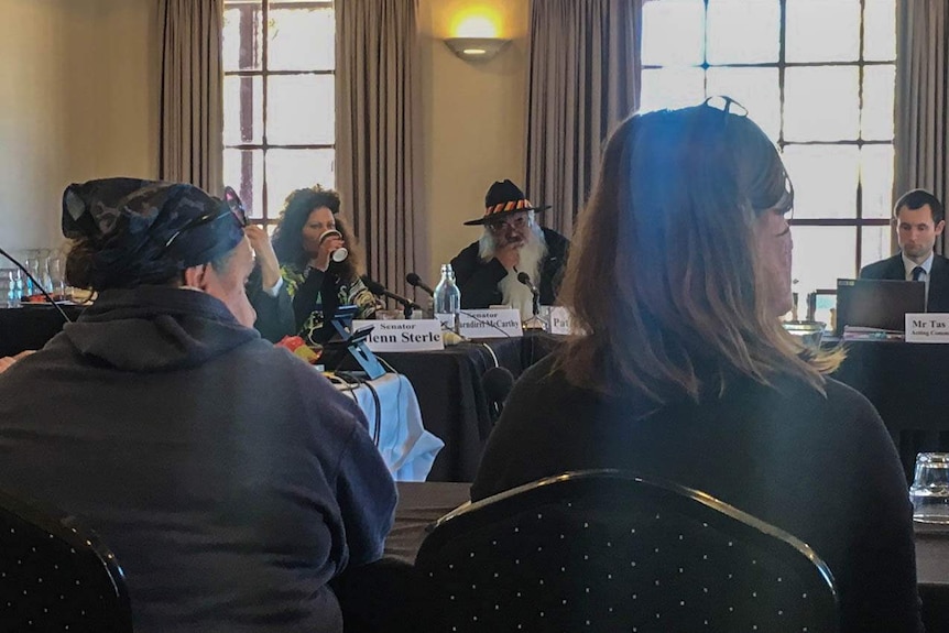 Members of the public watch on during a Senate Committee hearing in Kalgoorlie-Boulder, Western Australia