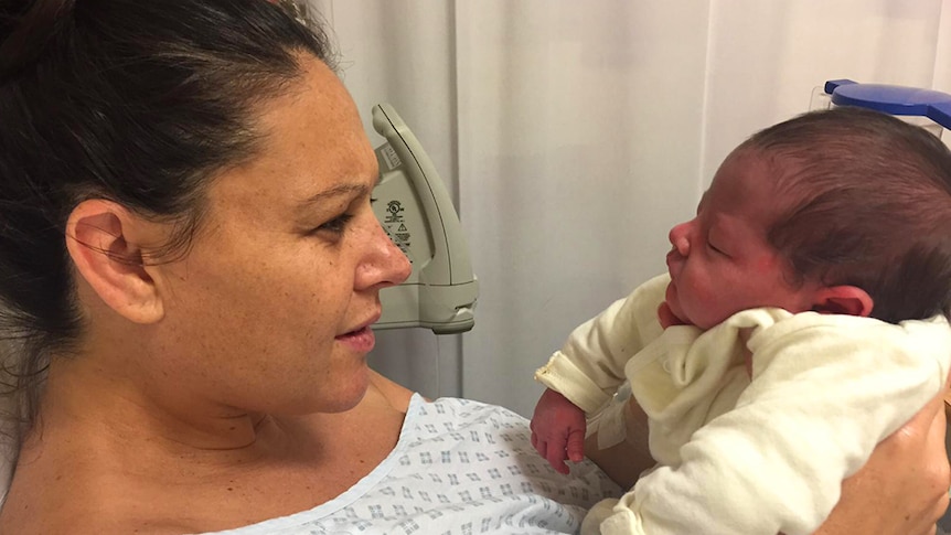 Josie Sargent takes her first looks at her newborn baby