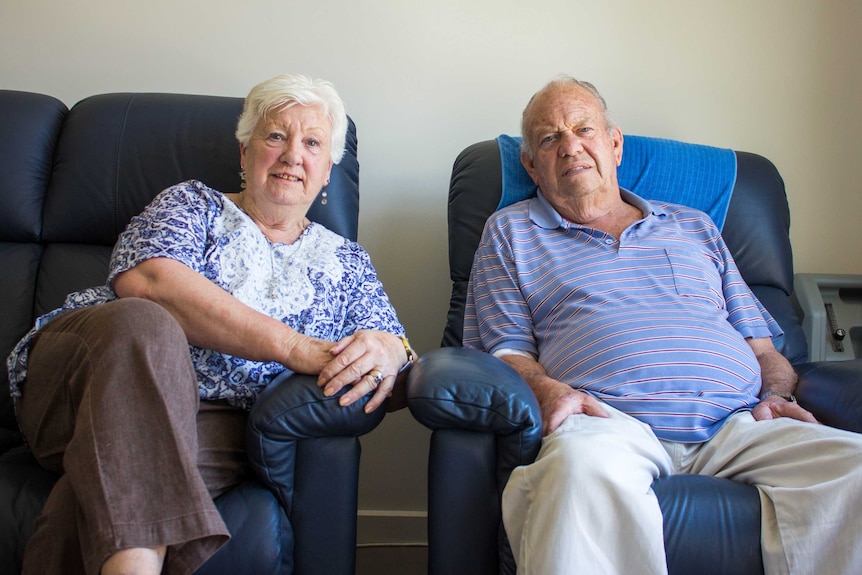 Margaret and Kenneth Cook sitting on armchairs in their Morwell home