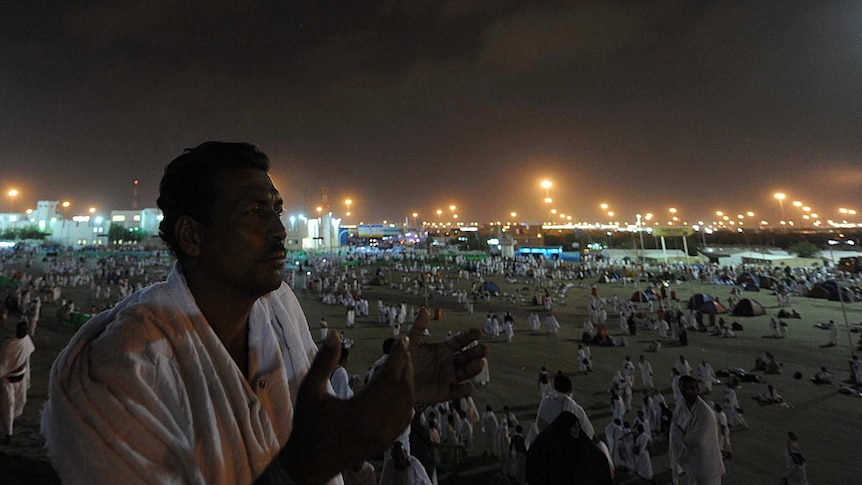 Muslim pilgrim prays on Mount Arafat