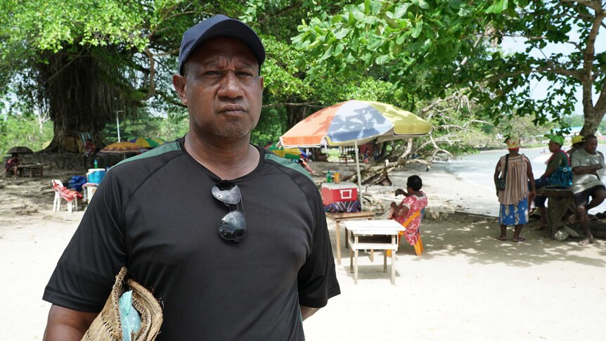 Ben Pokarup from the Manus Province Civil Society stands at the shoreline on Manus Island