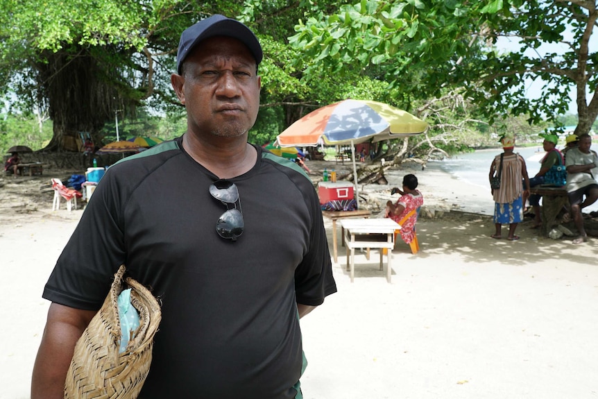 Ben Pokarup from the Manus Province Civil Society stands at the shoreline on Manus Island