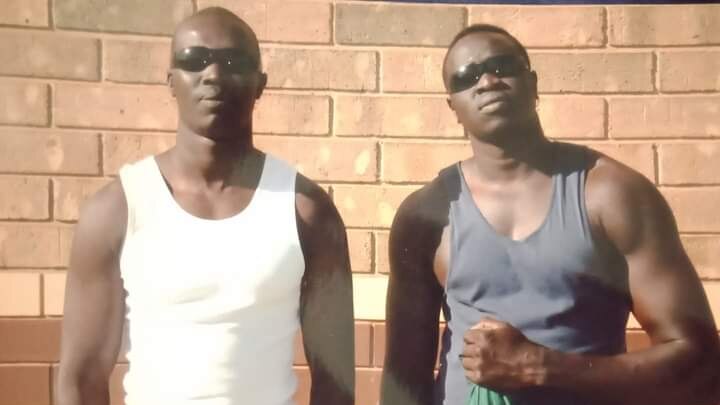 Juma and Zackaria Chol wear sunglasses. they are photographed in prison