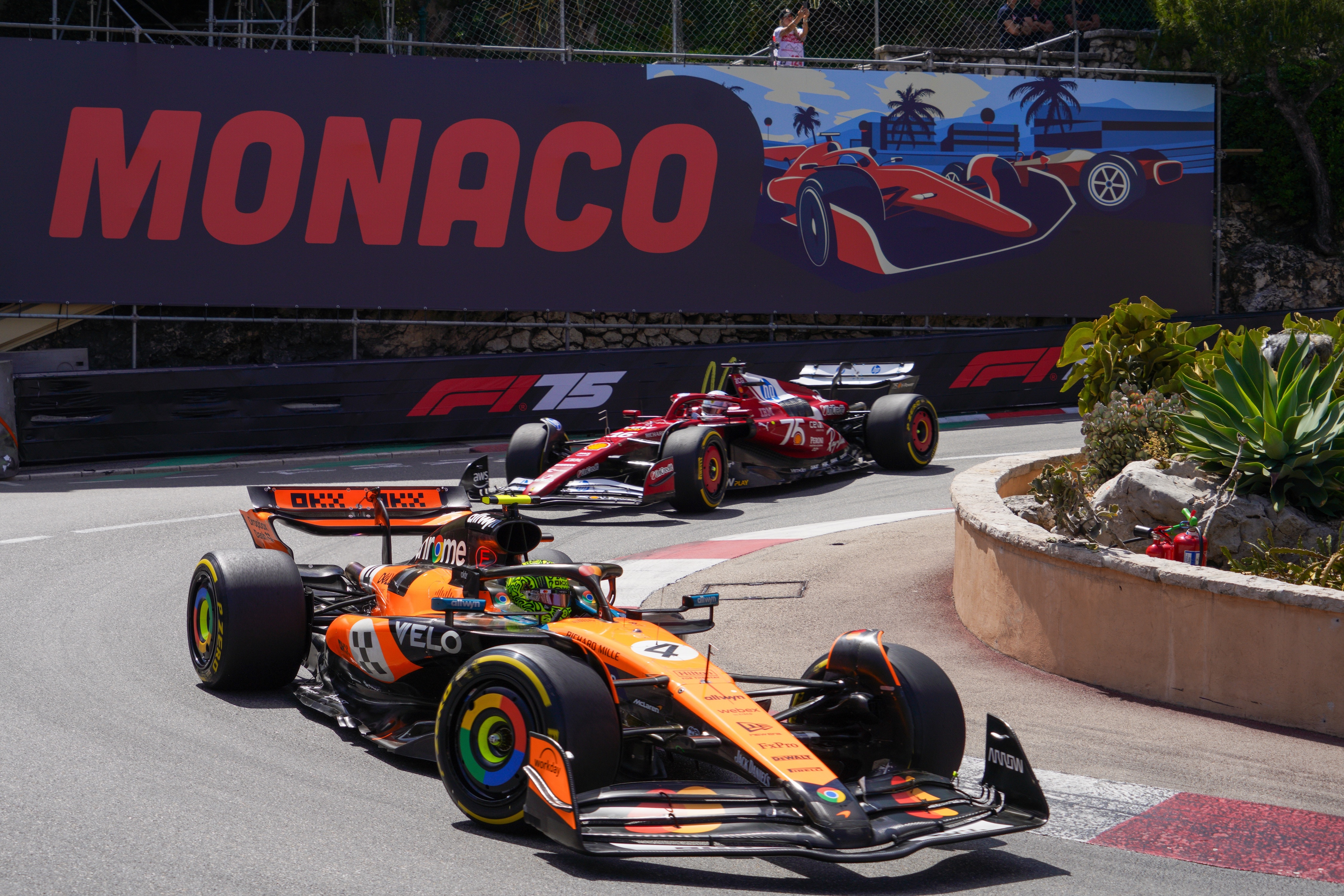 Lando Norris leads Charles Leclerc at the Monaco hairpin