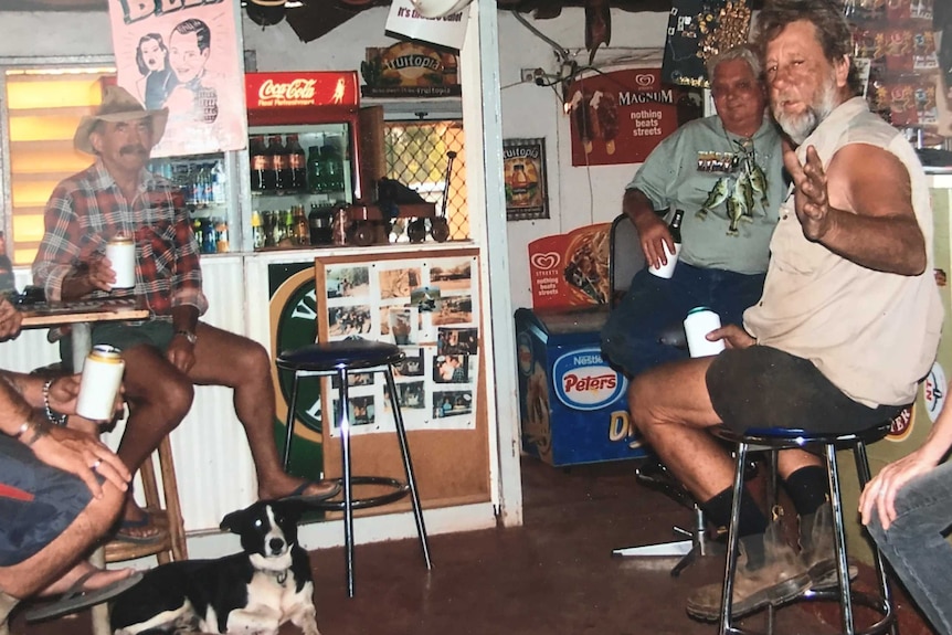 Picture of a group of men sitting at a bar