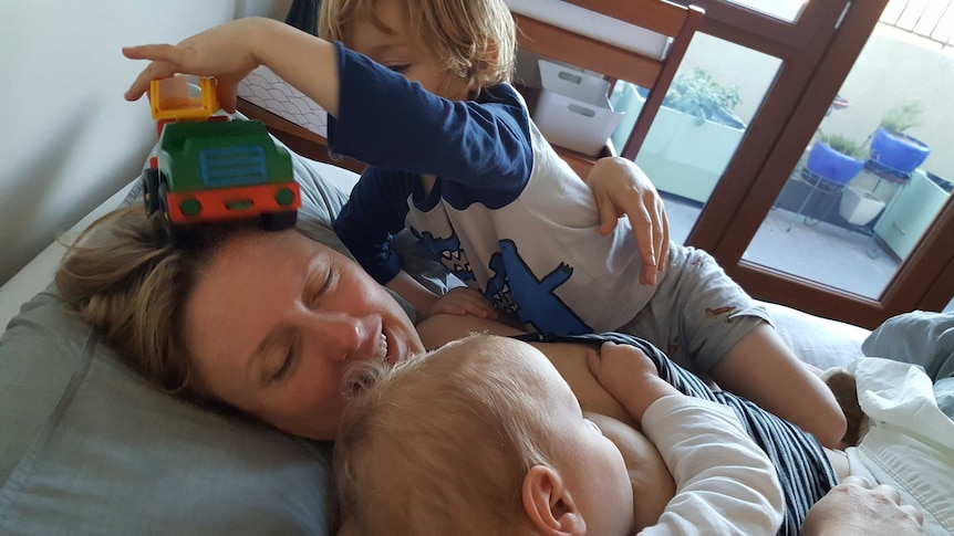 Marion with eldest son William and breastfeeding Alexander