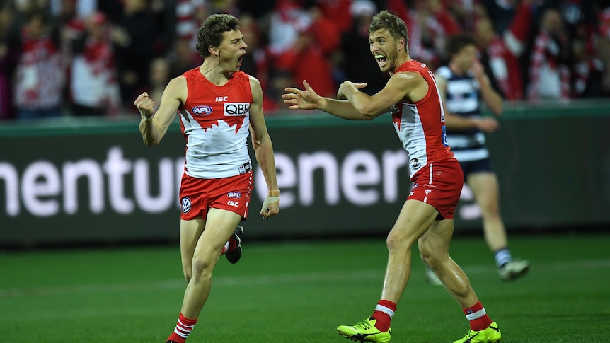 Will Hayward and Kieran Jack celebrate a goal against Geelong