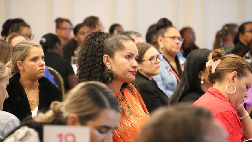 Many Indigenous women sitting in a conference.