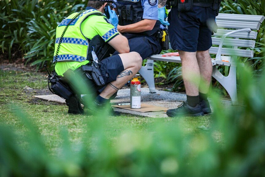 Police with canister outside Woodside AGM. 28 April, 2023