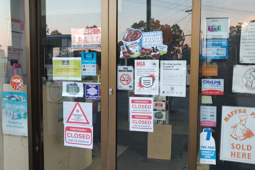 Timberline front door, posters saying closed due to COVID stuck up