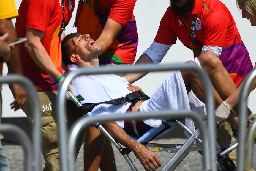 Yohann Diniz lies on a chair after finishing the race