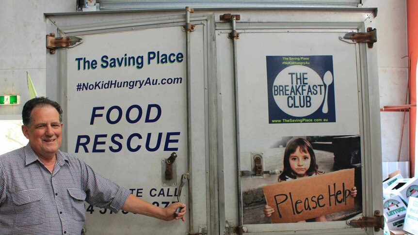 Dave Davis charity owner standing with food collection truck