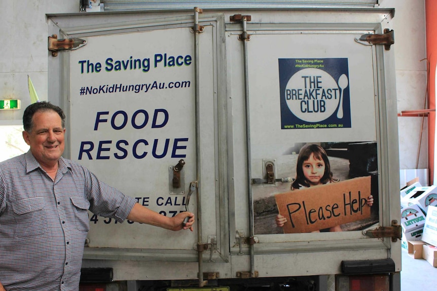 Dave Davis charity owner standing with food collection truck