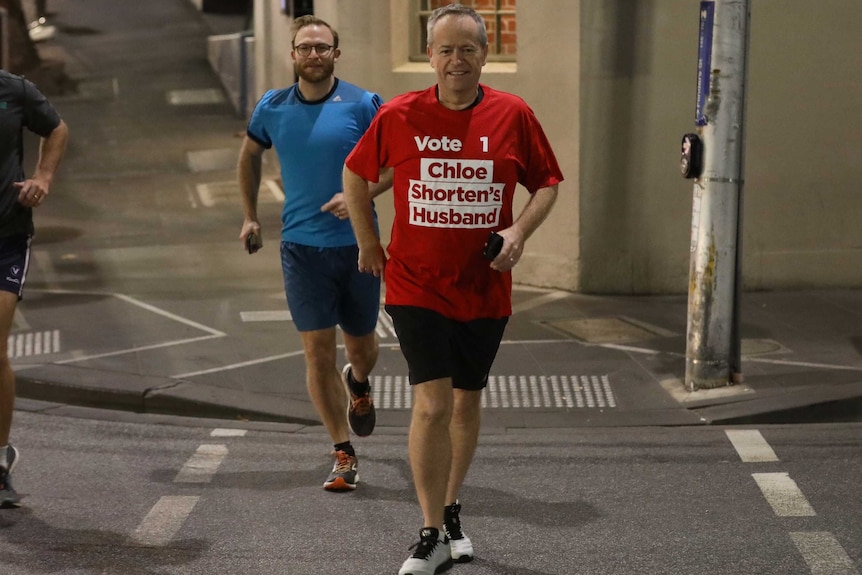 Bill Shorten wearing a shirt saying "Vote 1 Chloe Shorten's Husband"