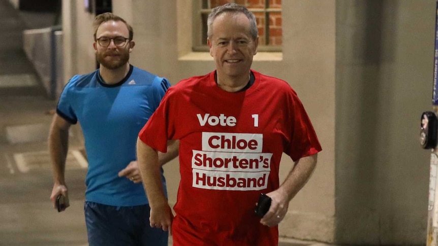 Bill Shorten wearing a shirt saying "Vote 1 Chloe Shorten's Husband"