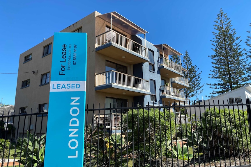 For Lease sign outside Gold Coast unit complex.