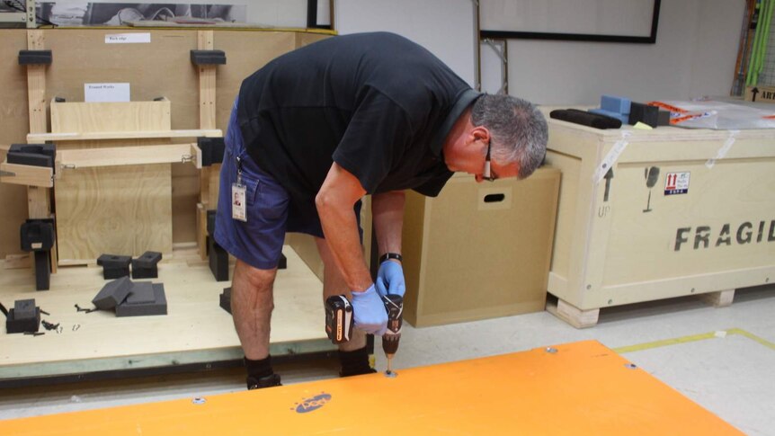 Pete Faulkner sealing the lid of the crate carrying the Blaue map from Canberra to Sydney.