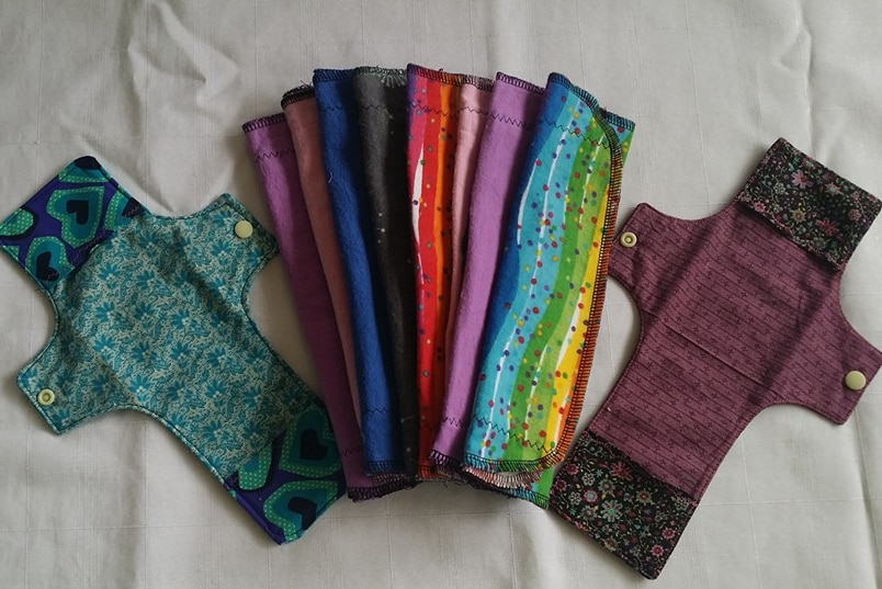 A set of reusable sanitary pads with colourful designs.