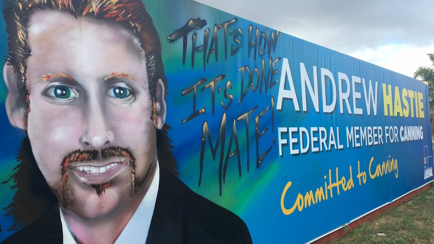 A painted Andrew Hastie banner shows his face with a goatee next to the words 'That's how it's done mate'.