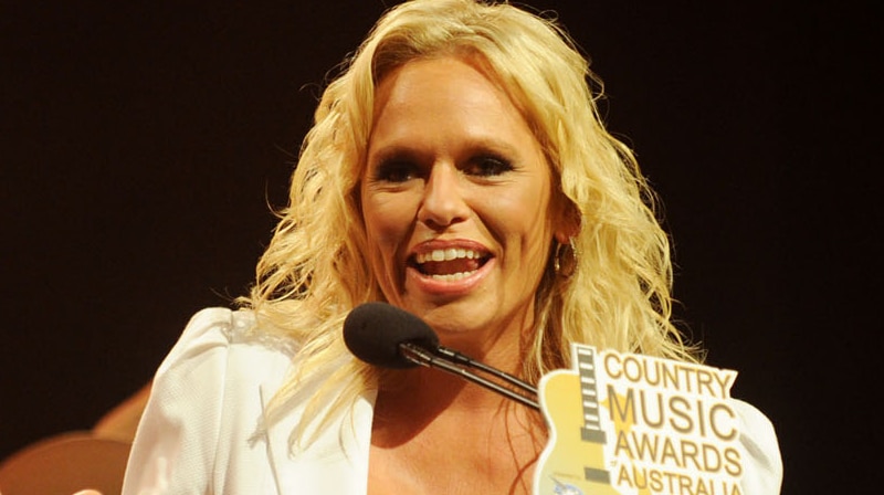 Beccy Cole accepts the Golden Guitar for Female Artist of the Year.
