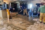 Crews mop up a muddy home