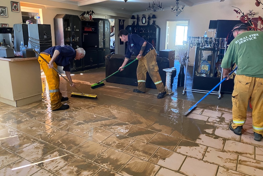 Crews mop up a muddy home