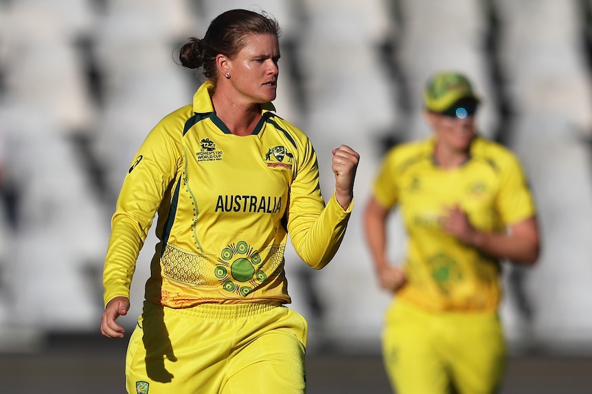 An Australian female spinner pumps her left fist as she celebrates a wicket against India at the T20 World Cup.