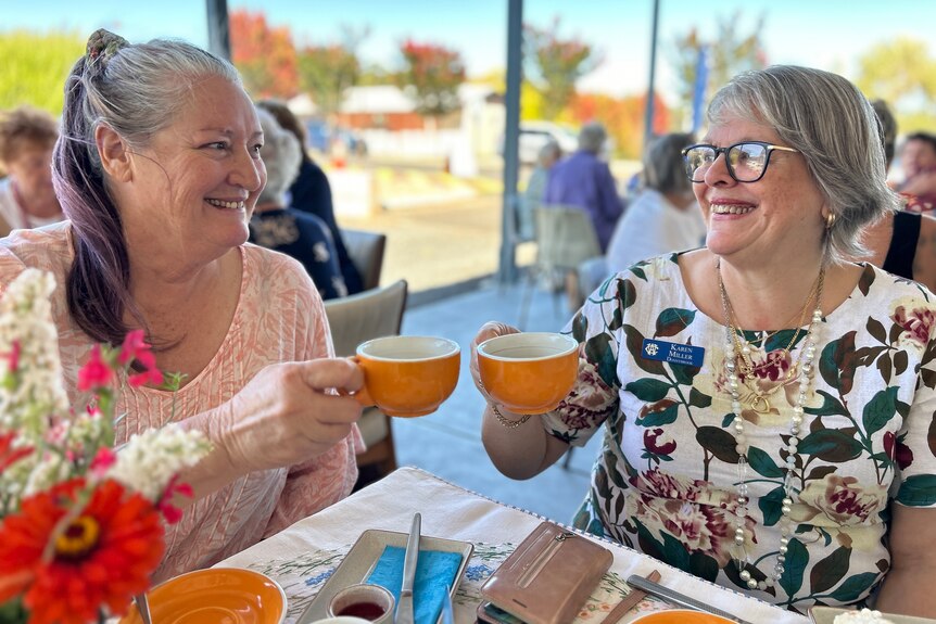 two women enjoying a cup of tea