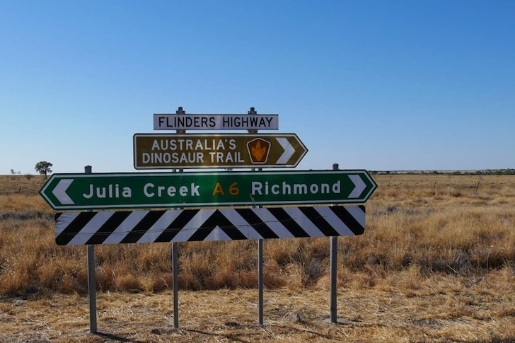 A backcountry road sign pointing the way to Julia Creek and Richmond.