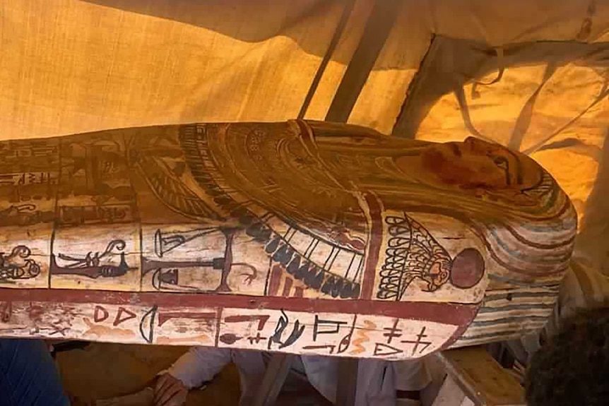 An Egyptian coffin inside a tent