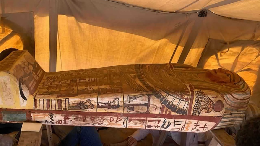 An Egyptian coffin inside a tent