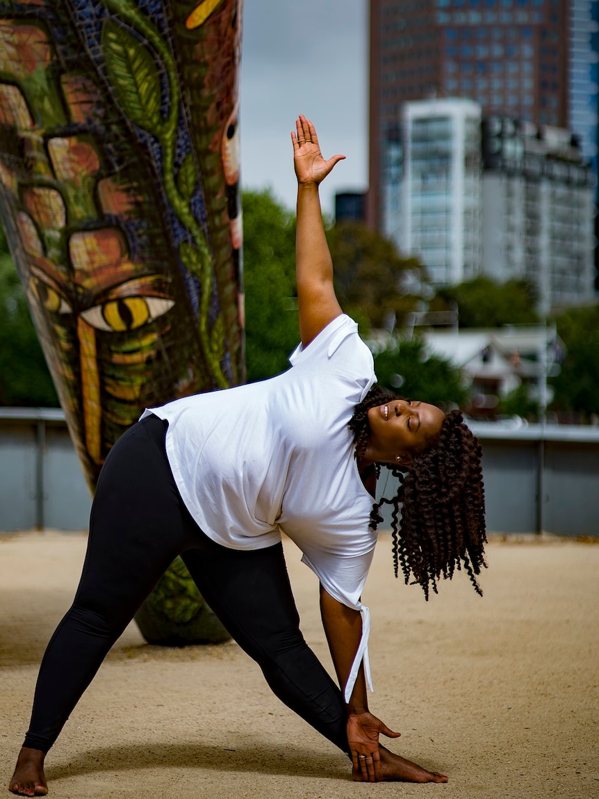 A young woman in a yoga pose.