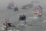Several dozen fishing boats set off to the disputed islands in the East China Sea