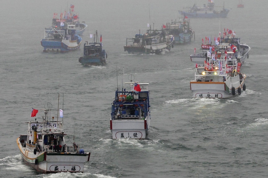 Several dozen fishing boats set off to the disputed islands in the East China Sea