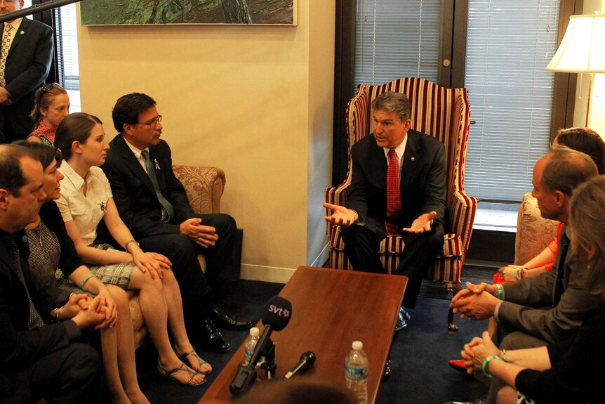 Senator Joe Manchin meets with relatives of the victims.