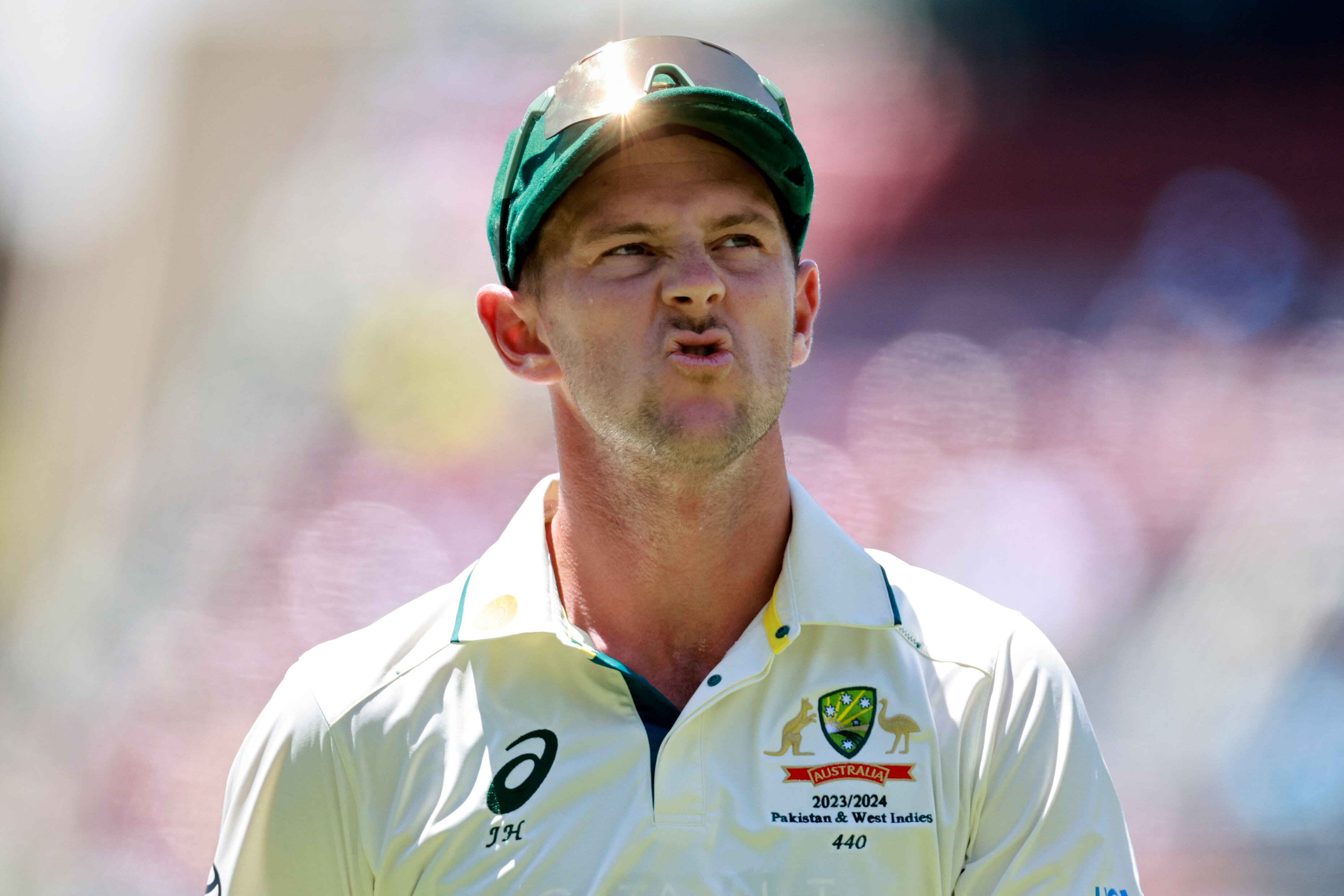 Josh hazlewood pulls a face
