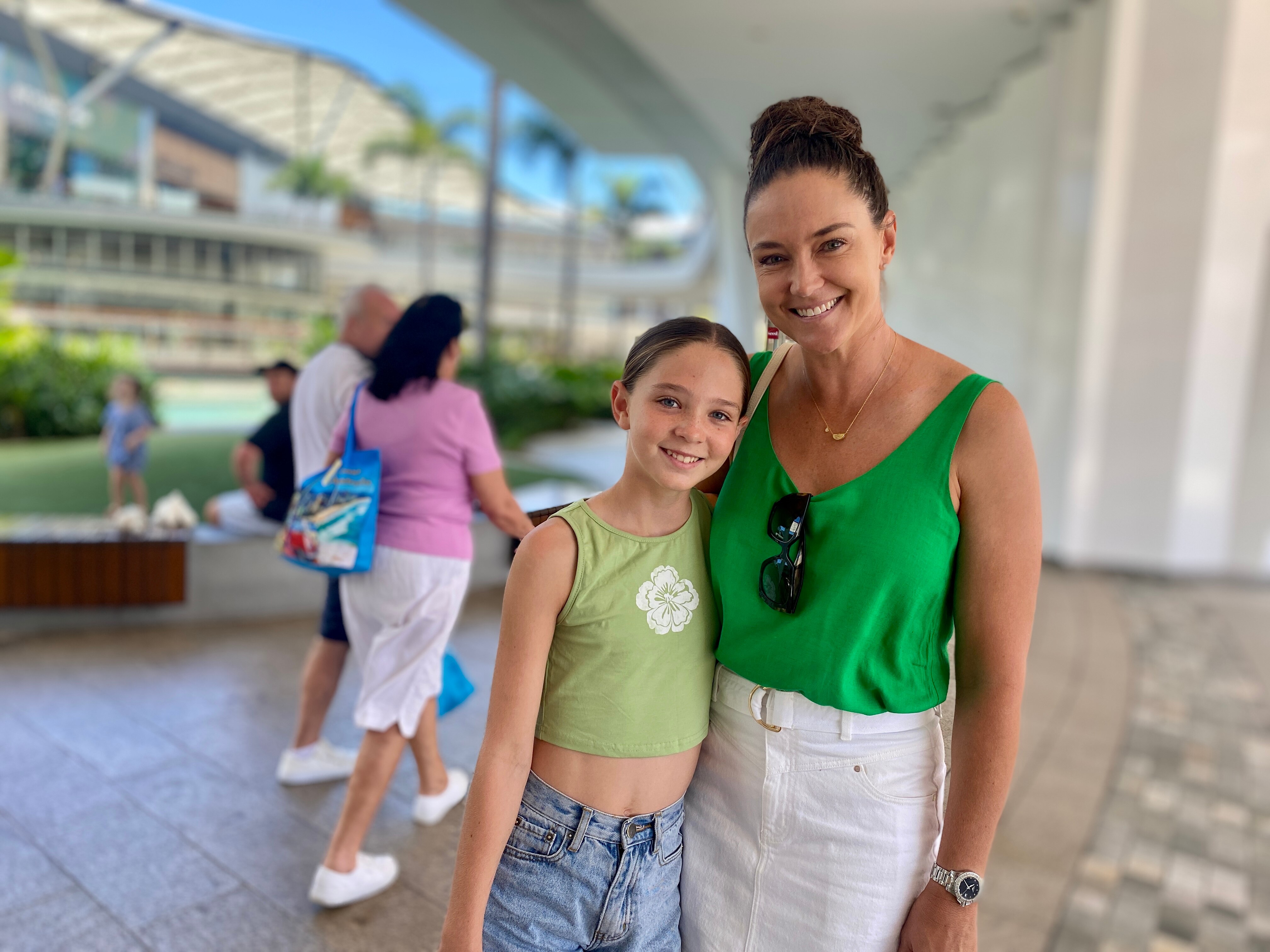 A mother and daughter at a shopping centre.