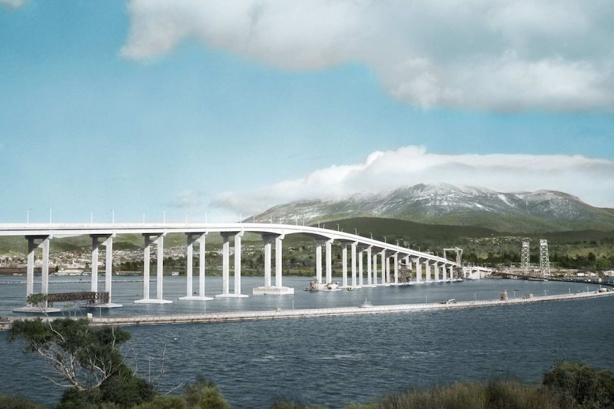 Photograph of an arched bridge with a snowy mountain covered with cloud behind it, and a temporary bridge next to it