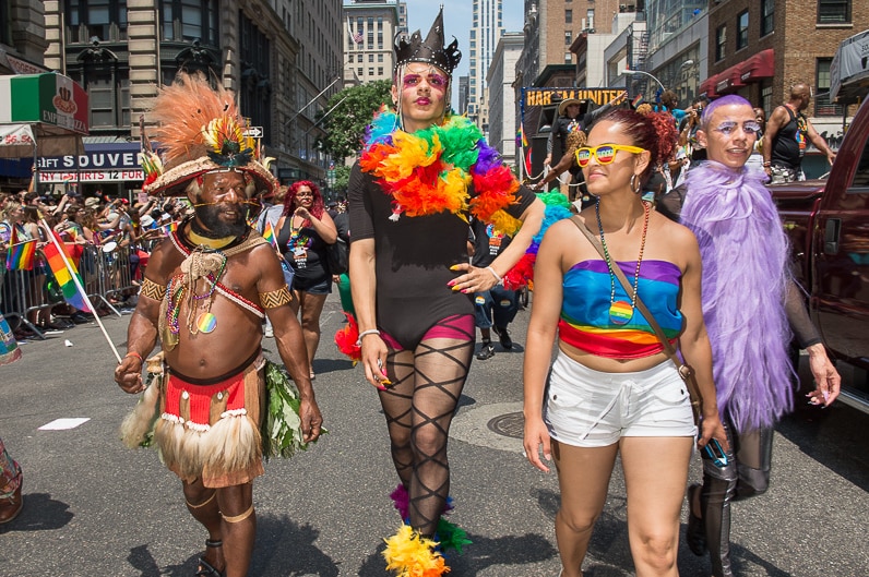 Huli chief Mundiya Kepanga with participants of a gay pride parade in Manhattan