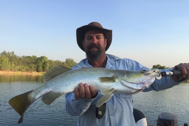 A man holding a large fish