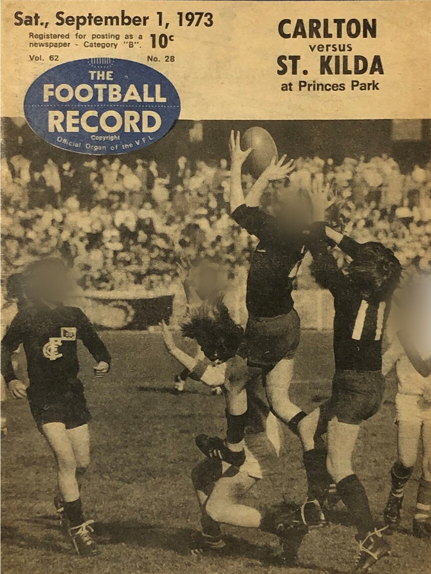 Carlton Little League players jostle for the ball in a black and white photo on the cover of the Football Record.