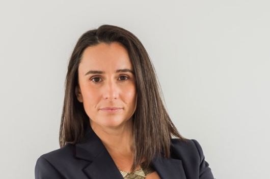 A middle shot of woman with her arms folded