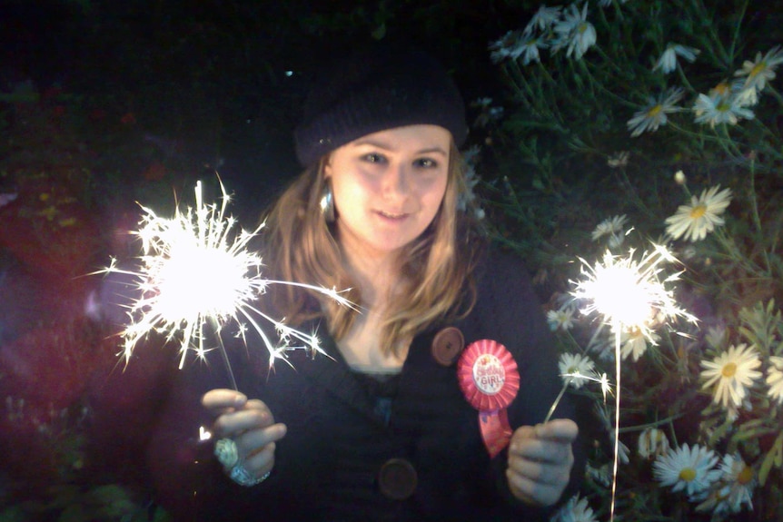 Maria Liordos holds firecrackers.