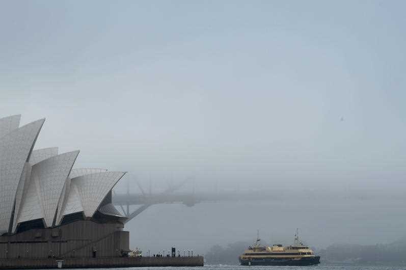 The Opera House with a barely visible harbour bridge behind.