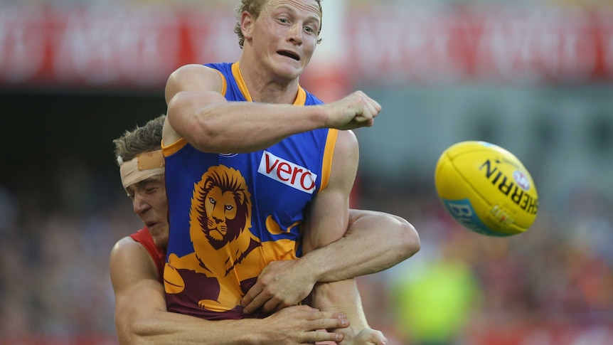 Mitch Golby in action for the Lions against the Demons